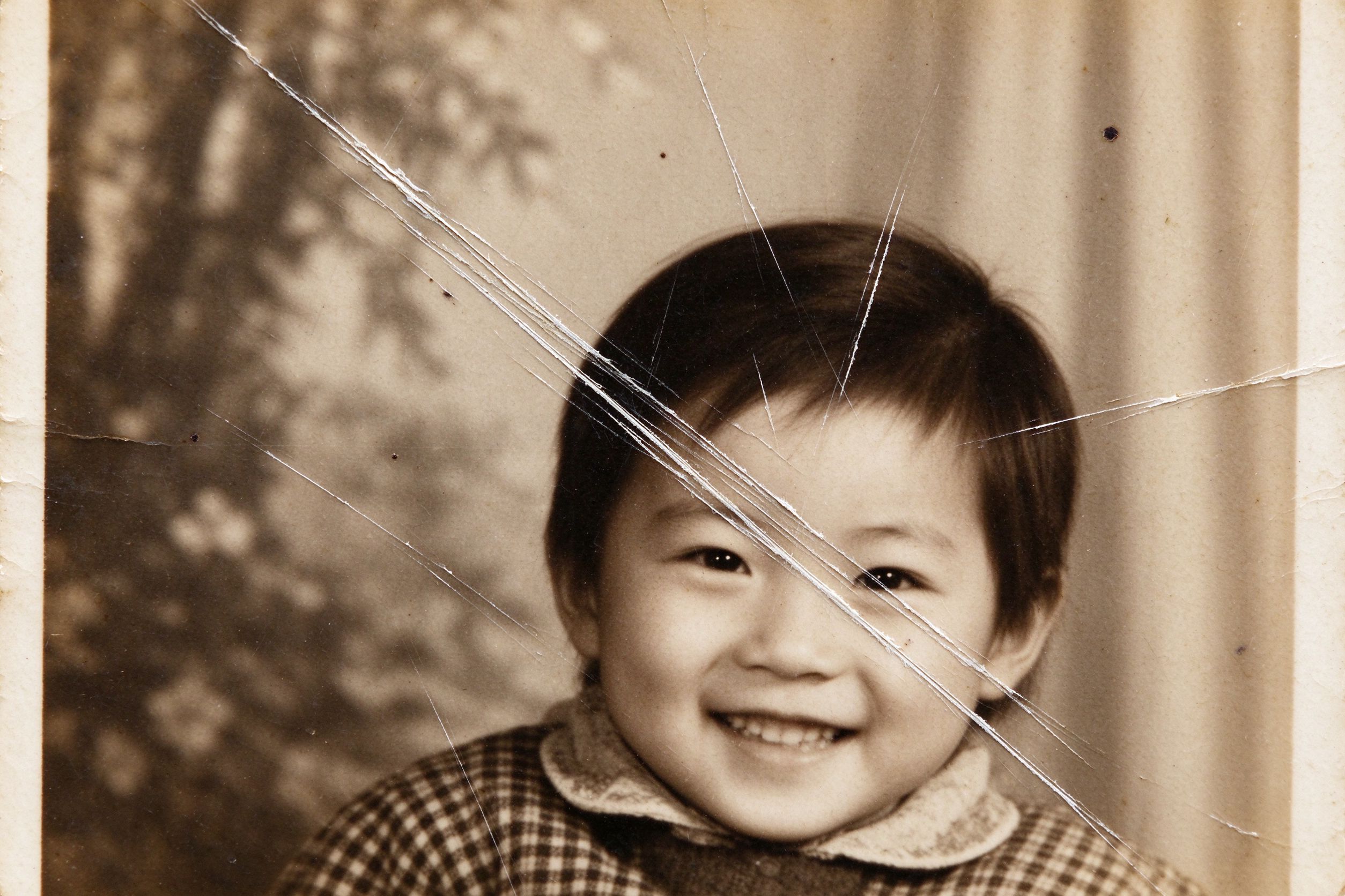 Old photograph covered in fine scratches